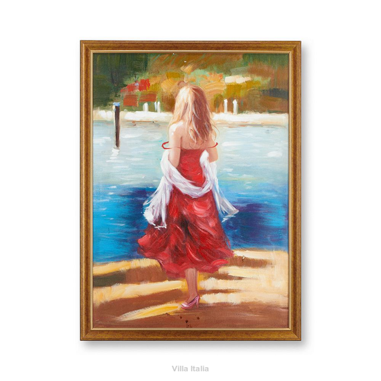 Obraz przedstawiający kobietę nad brzegiem wody, w cerwonej sukni. Obraz jest w drewnianej ramie.