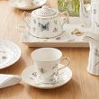filiżanka ze spodkiem z kremowej porcelany z dekoracją roślinną