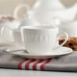 porcelanowa filiżanka ze spodkiem i łyżeczką