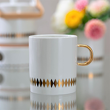 Nowoczesny kubek porcelanowy ze złotem